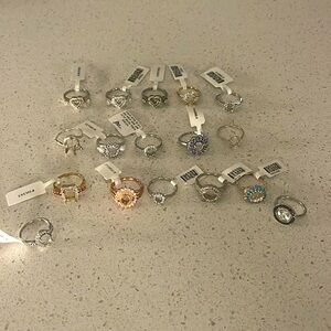 Lot of 17 beautiful rhodium plated sterling and cz and topaz halo designs